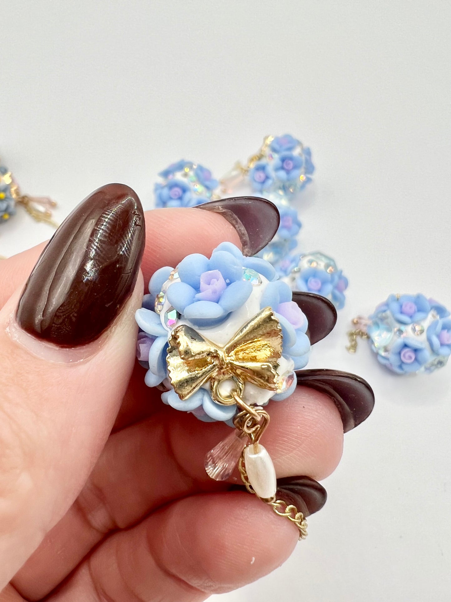 Light Blue Flower with Bow Bead